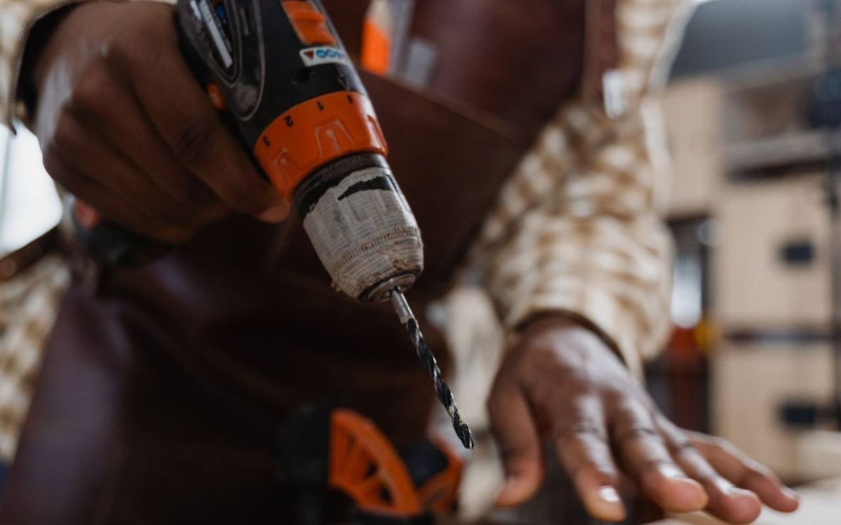 Craftsman drilling into wood with a cordless power drill